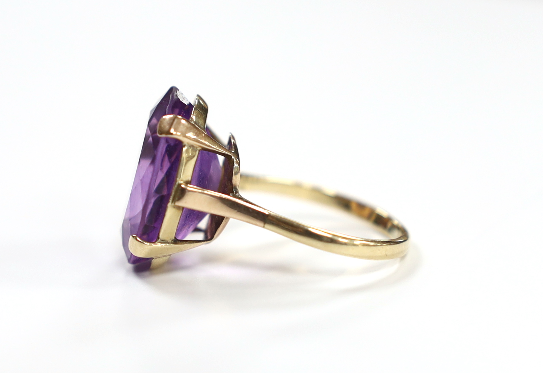 A 9ct and single stone oval cut amethyst set dress ring, size R/S, gross weight 7.5 grams.